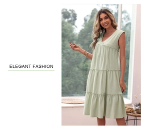 Detail of mint green sleeveless V-neck dress with tiered ruffles and linen texture