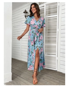 Detail of light blue floral maxi dress featuring high slit and vintage short sleeves