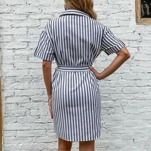 Back view of blue and white vertical striped shirt dress with waist tie and lapel collar