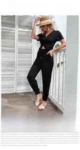 Close-up of black V-neck knot top and high waist drawstring jogger set for women