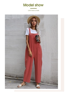 Detail view of brick red cotton linen jumpsuit with wide legs and side patch pockets