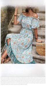 Detail of off-shoulder floral maxi dress with ruffle neckline and wood buttons