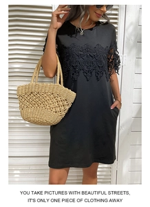 Detail of delicate black lace crochet trim on the sleeves and neckline of a summer dress