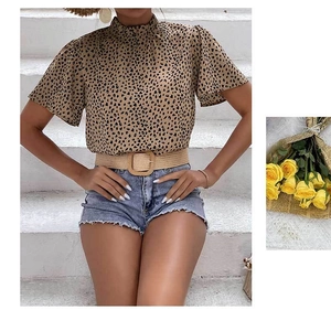 Detail of leopard print short sleeve blouse with mock neck ruffle and flared sleeves