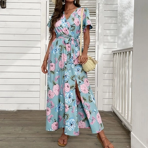 Light blue floral summer dress with V-neck, wrap waist, and side slit for a retro look