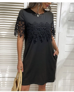 Detail view of intricate black floral lace stitching and hollow embroidery on the sleeve