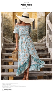 Detail of floral off-shoulder dress with ruffled sleeves and bohemian print