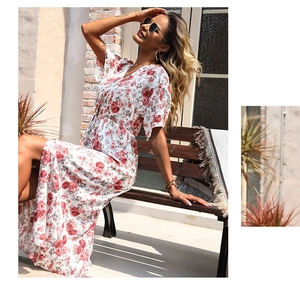 Detail of summer dress featuring red floral oil painting print and slit hem design