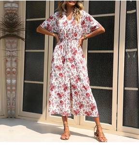 Detail of white V-neck floral midi dress with wooden buttons and drawstring waist
