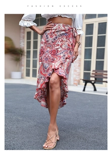 Detail of high waist wrap skirt featuring ethnic paisley print and ruffled hemline