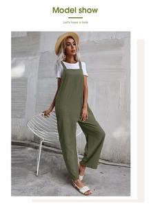 Outdoor model shot of loose army green jumpsuit with large pockets and white t-shirt