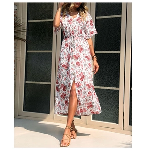 Detail view of V-neck button closure and drawstring waist on a floral midi dress