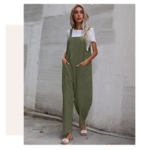 Detail of olive green wide-leg jumpsuit with front pockets and breathable cotton fabric