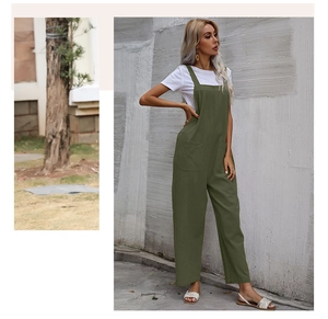 Detail of loose dark green jumpsuit with large front pockets and wide-leg cut style