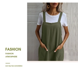 Close-up of olive green jumpsuits with wide straps and functional side patch pockets