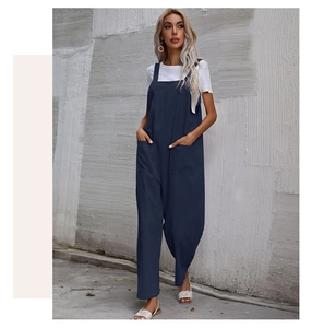 Close-up of a casual navy blue wide-leg jumpsuit with pocket and lightweight draped fabric