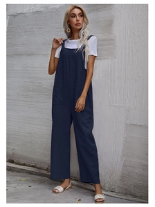 Detail of navy blue wide-leg jumpsuit with square neck and side pockets on casual fabric