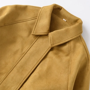 Close-up of ginger yellow suede bomber jacket featuring turn-down collar and stitching