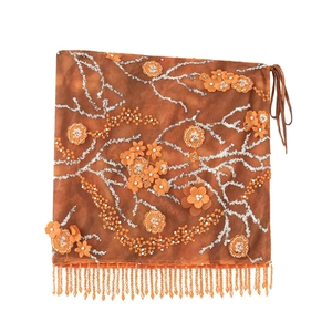 Jupe de bikini ethnique orange avec broderie de paillettes et longs pompons perlés