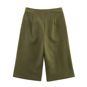 Detailed view of olive green wide-leg culottes featuring premium suede texture and pleats