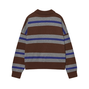 Detail of striped knit Polo shirt with brown and blue patterns and ribbed cuffs
