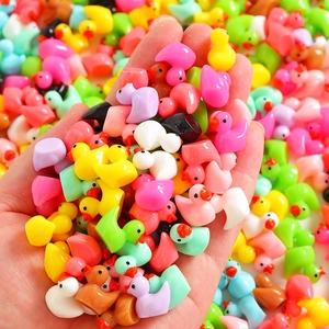 Miniature colorful resin ducks for DIY crafts and micro landscape decoration in hand
