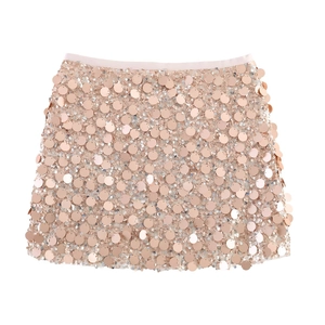 Detailed view of champagne gold mini skirt with large round sparkling sequins