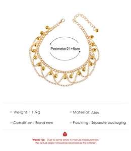 Detailed macro view of a bohemian gold alloy bell anklet with full size specifications