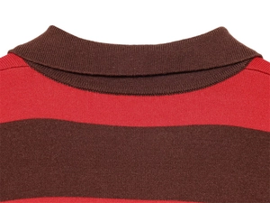 Close-up of the polo collar and fine knit texture on the red and brown striped top