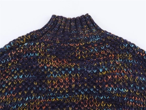 Close-up of a high-neck purple melange knit sweater with colorful speckled fibers