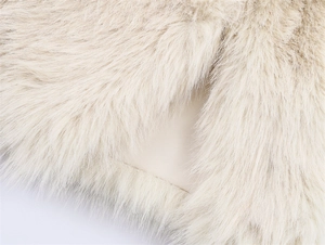 Detailed macro view of soft cream faux fur texture with smooth inner lining fabric