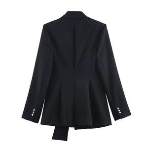 Rear view of black blazer showing unique asymmetrical hem and gold cuff buttons