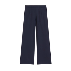Close-up of dark blue wide-leg suit trousers with waist darts and smooth drape fabric