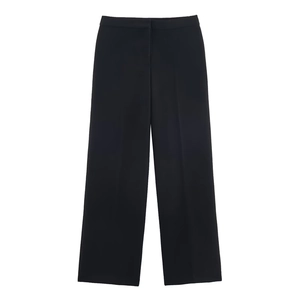 Detail shot of high-waist black wide-leg trousers with elegant drape and clean silhouette