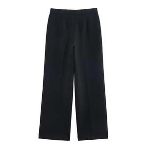 Detailed view of high-waisted wide-leg black suit trousers with elegant pleated front design