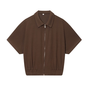 Women's dark brown short sleeve zip-up jacket with textured fabric and elastic hem