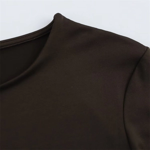 Macro shot of seamless round neckline and knitted texture on brown long sleeve bodysuit
