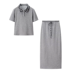 Two-piece gray set featuring a short-sleeve polo shirt and a midi skirt with plaid details