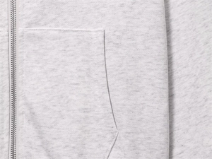 Macro shot of light heather grey fleece hoodie featuring metal zipper and seam detail