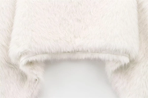 Detailed close-up of premium white faux fur texture with high-quality stitching detail