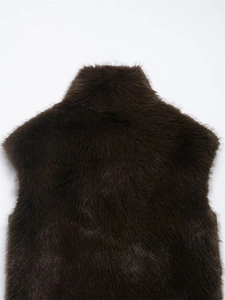 Detailed macro view of dark coffee faux fur texture and collar on a plush fashion vest