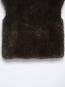 Close-up of thick dark brown faux fur texture on a luxury fashion vest for women