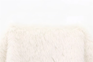 Detailed macro view showing the soft white faux fur texture and long fibers of the coat
