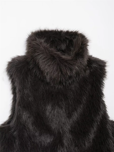Detailed view of high-collared dark faux fur vest with dense long-hair texture