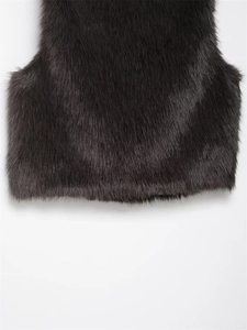 Detail shot of premium black faux fur vest showing thick texture and stitching finish
