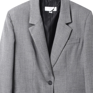 Chaqueta gris de espiga para mujer con hombreras acolchadas y solapa de muesca