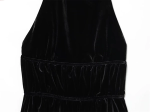 Detail of elegant black velvet ruched fabric showing fine textures and soft luster