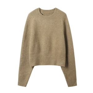 Fashionable minimalist women's short knit sweater in camel brown with ribbed cuffs