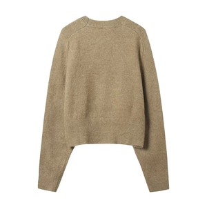 Close-up of camel knit sweater showing detailed ribbed crew neck and soft wool texture