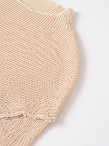 Detail shot showing the fine hollow knit mesh pattern and beige fabric texture